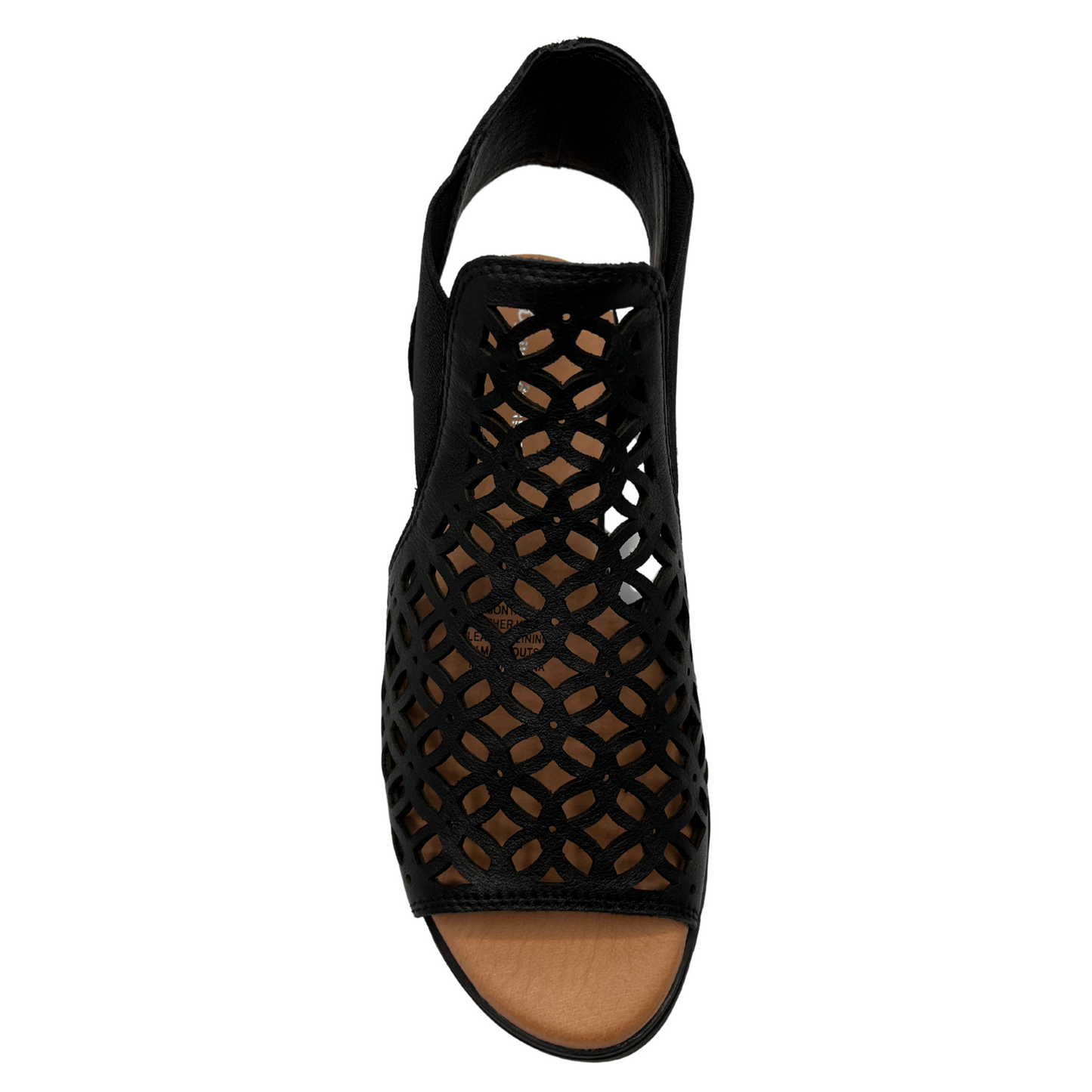 Top view of leather die cut wedge sandal in black. Low wedge heel, elasticized sides and open toe 