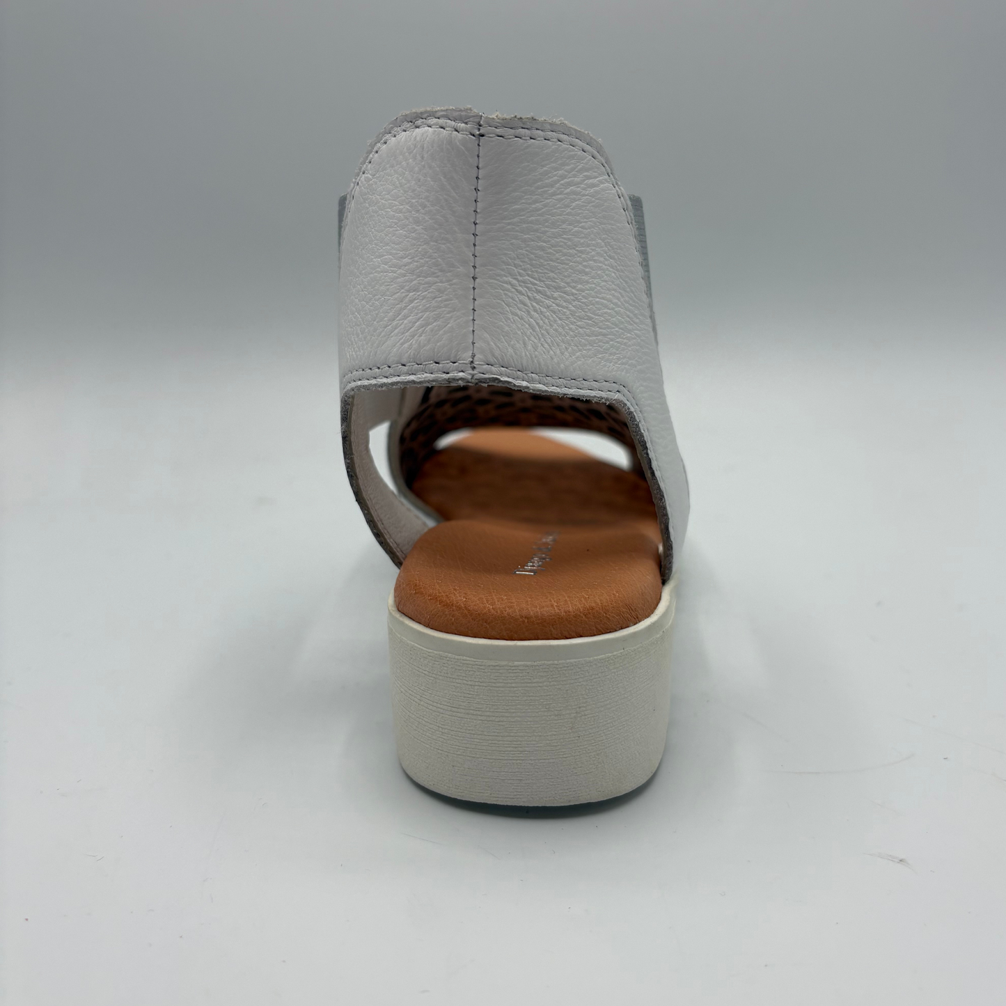 Gray sandal with a brown sole on a white background