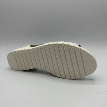 White sole of a shoe on a gray background