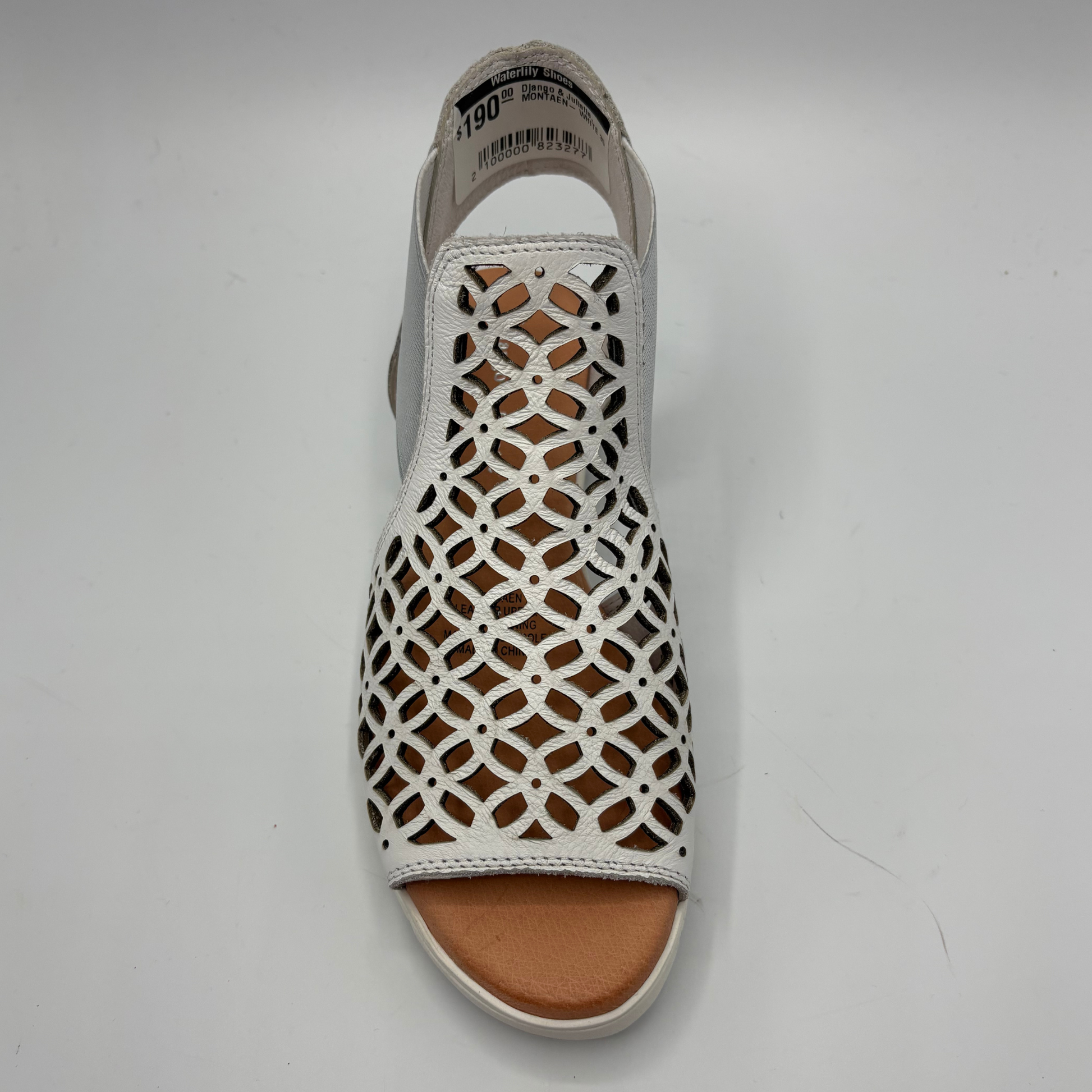 White sandal with lattice design on a gray background