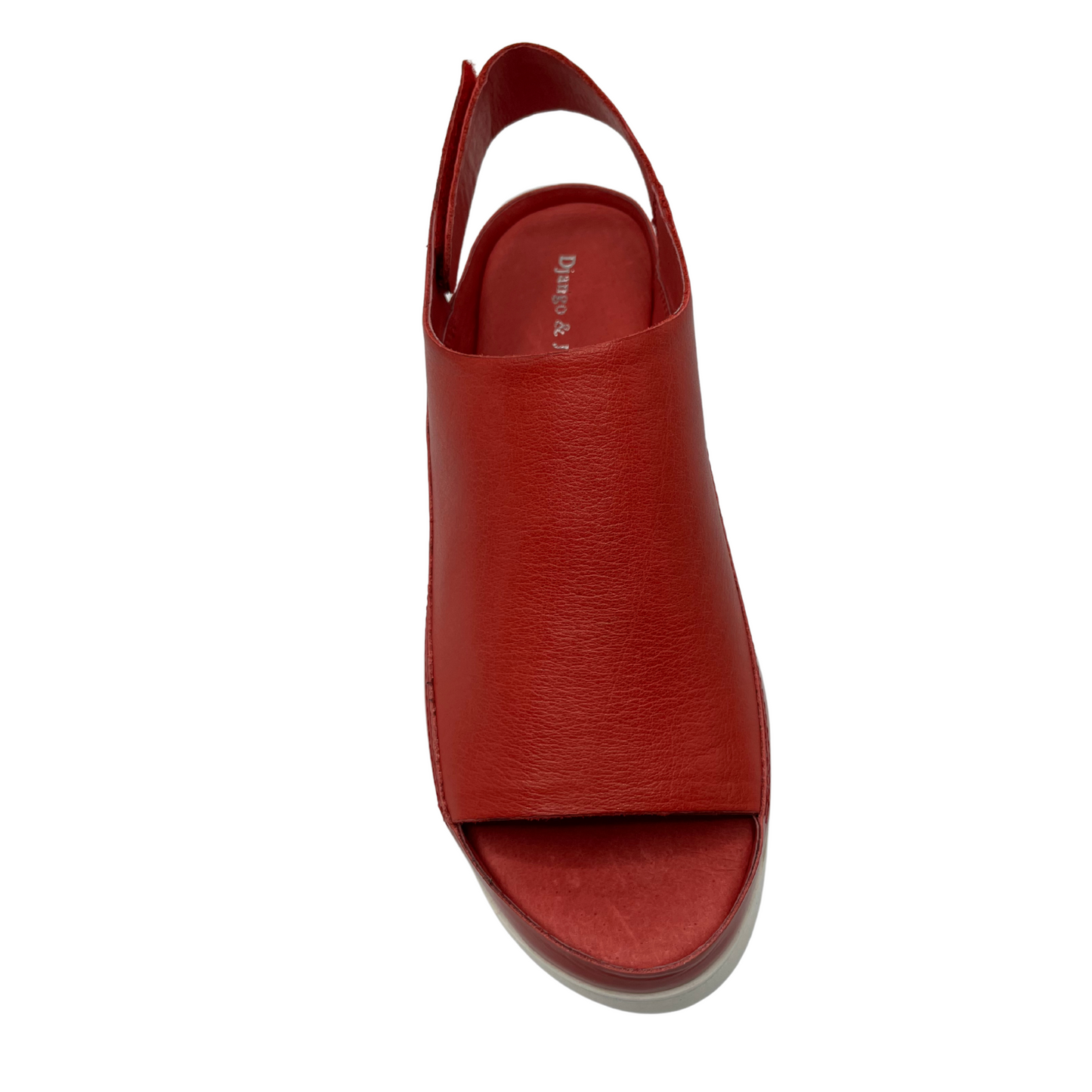 Top view of red leather sandal with white rubber outsole. Velcro slingback strap and rounded toe.