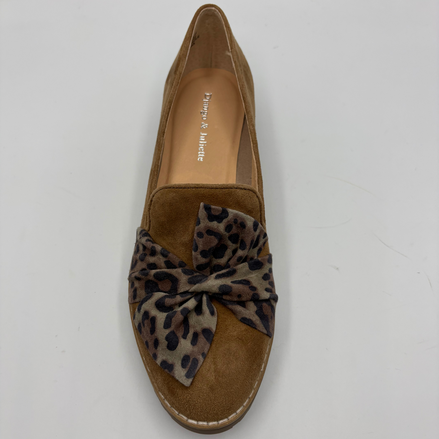 A single tan suede loafer with a leopard-print fabric bow on the toe, photographed from a top-down angle on a light gray background.