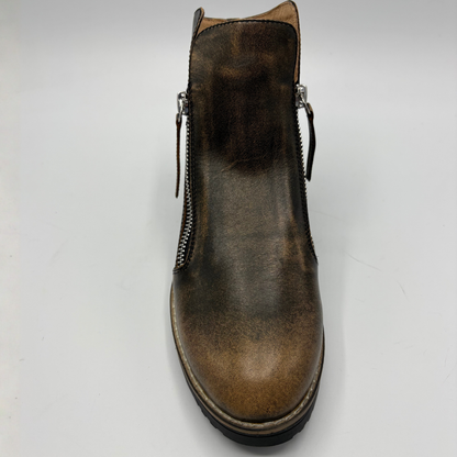 A single brown leather ankle boot with side zippers, shown from a top-down angle on a light gray background.