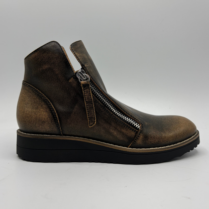 A single brown distressed leather ankle boot with a side zipper, shown in profile against a light gray background.
