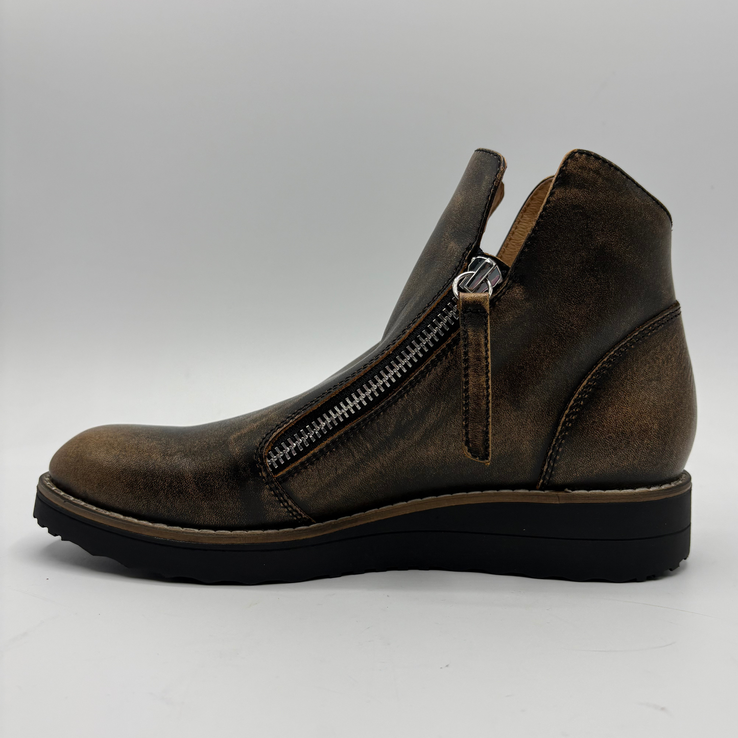 A single dark brown leather ankle boot with a side zipper, shown in profile against a light gray background.
