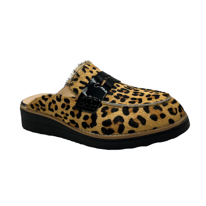 Angled view of leather slip on loafer in a leopard print and black patent strap on upper. Low wedge black sole and leather lined.