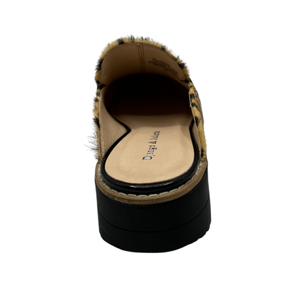 Back view of leather slip on loafer in a leopard print and black patent strap on upper. Low wedge black sole and leather lined.