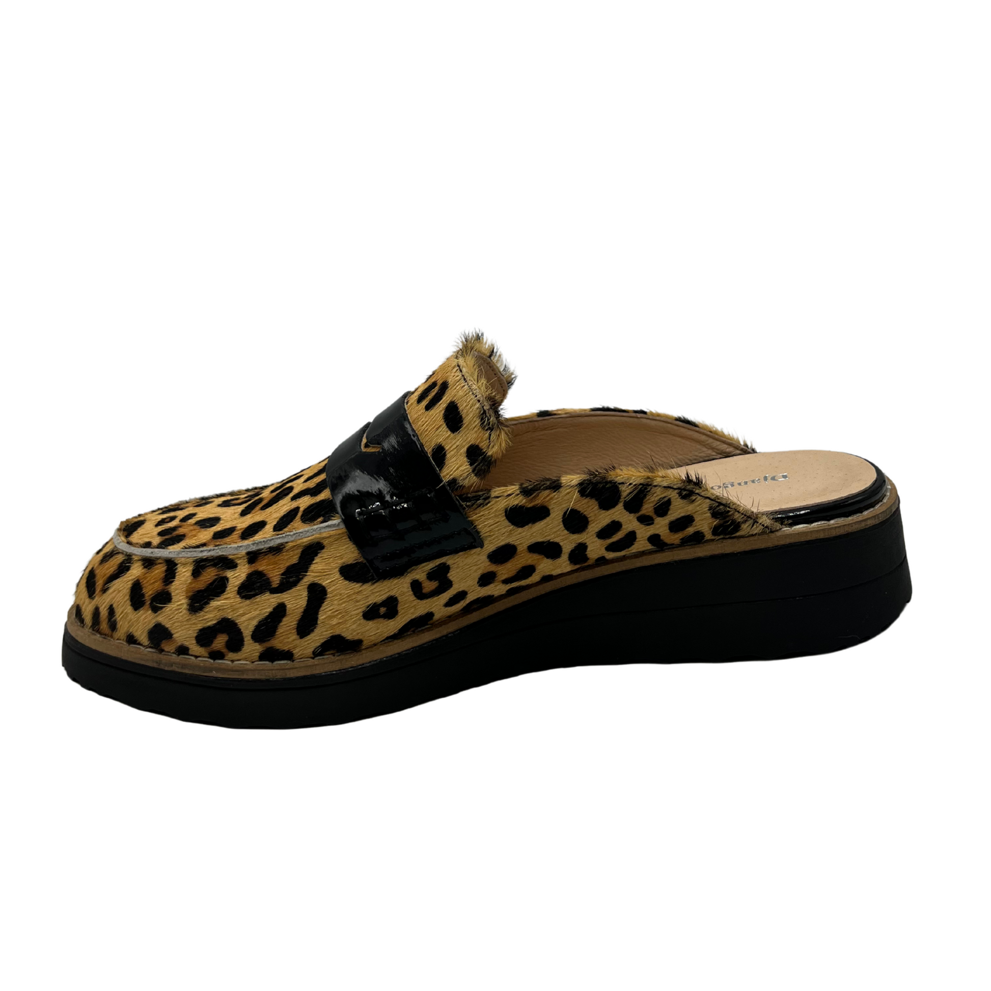 Left facing view of leather slip on loafer in a leopard print and black patent strap on upper. Low wedge black sole and leather lined.