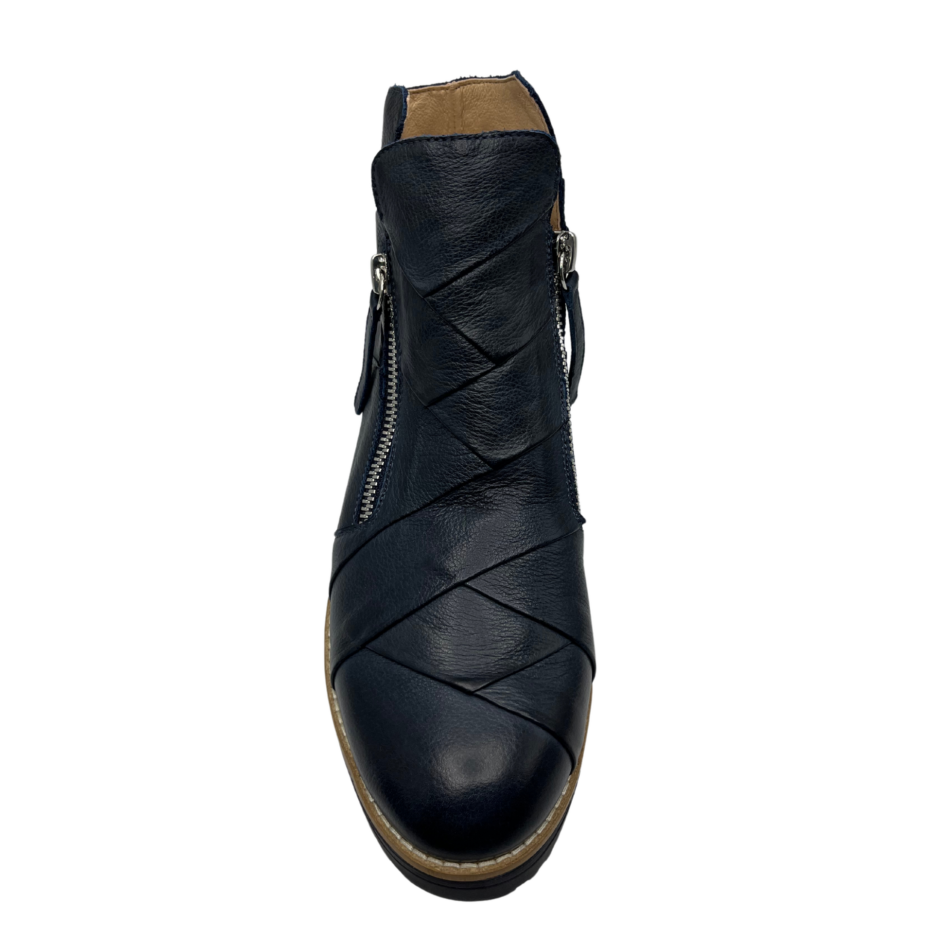 Top view of navy leather short boots with weave design on the upper with double zipper closures