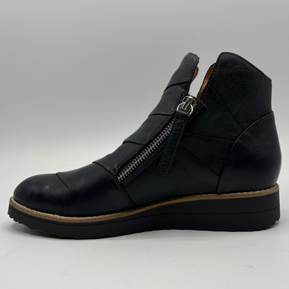 A black leather ankle boot with a side zipper, shown in profile against a light gray background.
