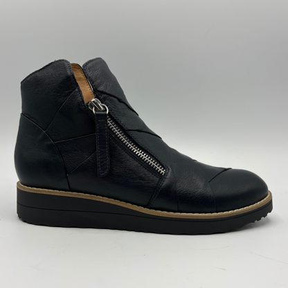 A black leather ankle boot with a side zipper, shown from a side profile view against a neutral gray background.
