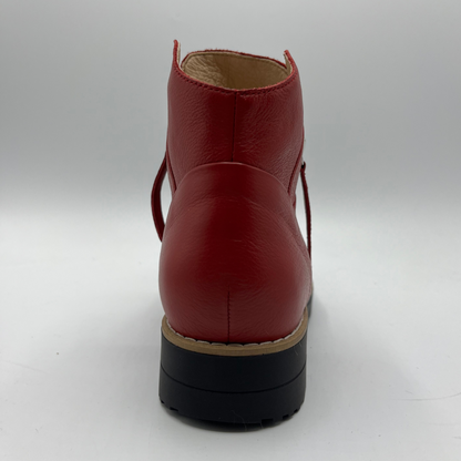 Red leather boot on a white background