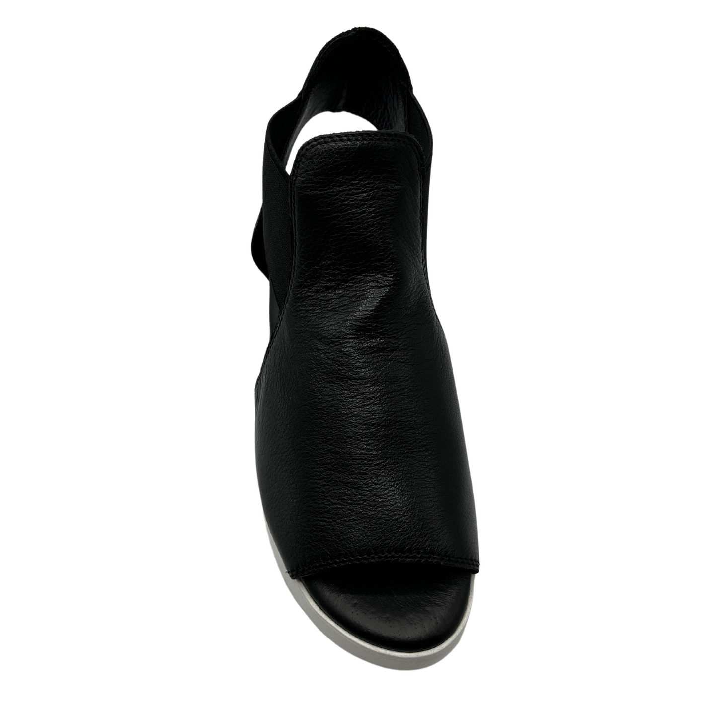 Top view of black leather sandal with elastic side straps and white outsole