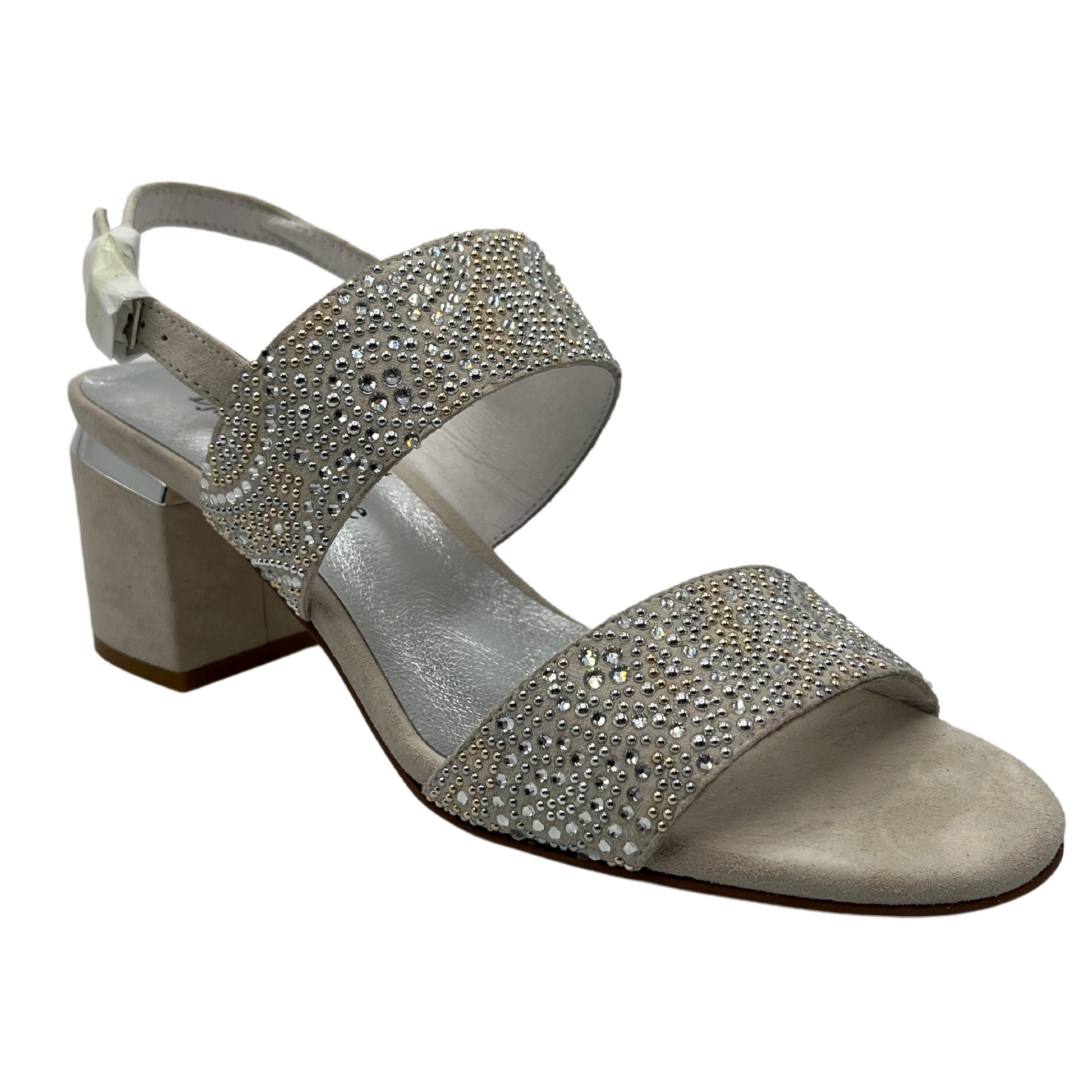 45 degree angled view of silver suede and leather sandal with beaded details and sling back strap