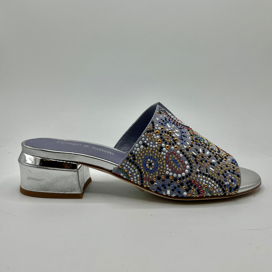 Right facing view of denim coloured mule sandal with beaded detail on upper