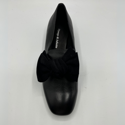 Black shoe with a bow on a white background