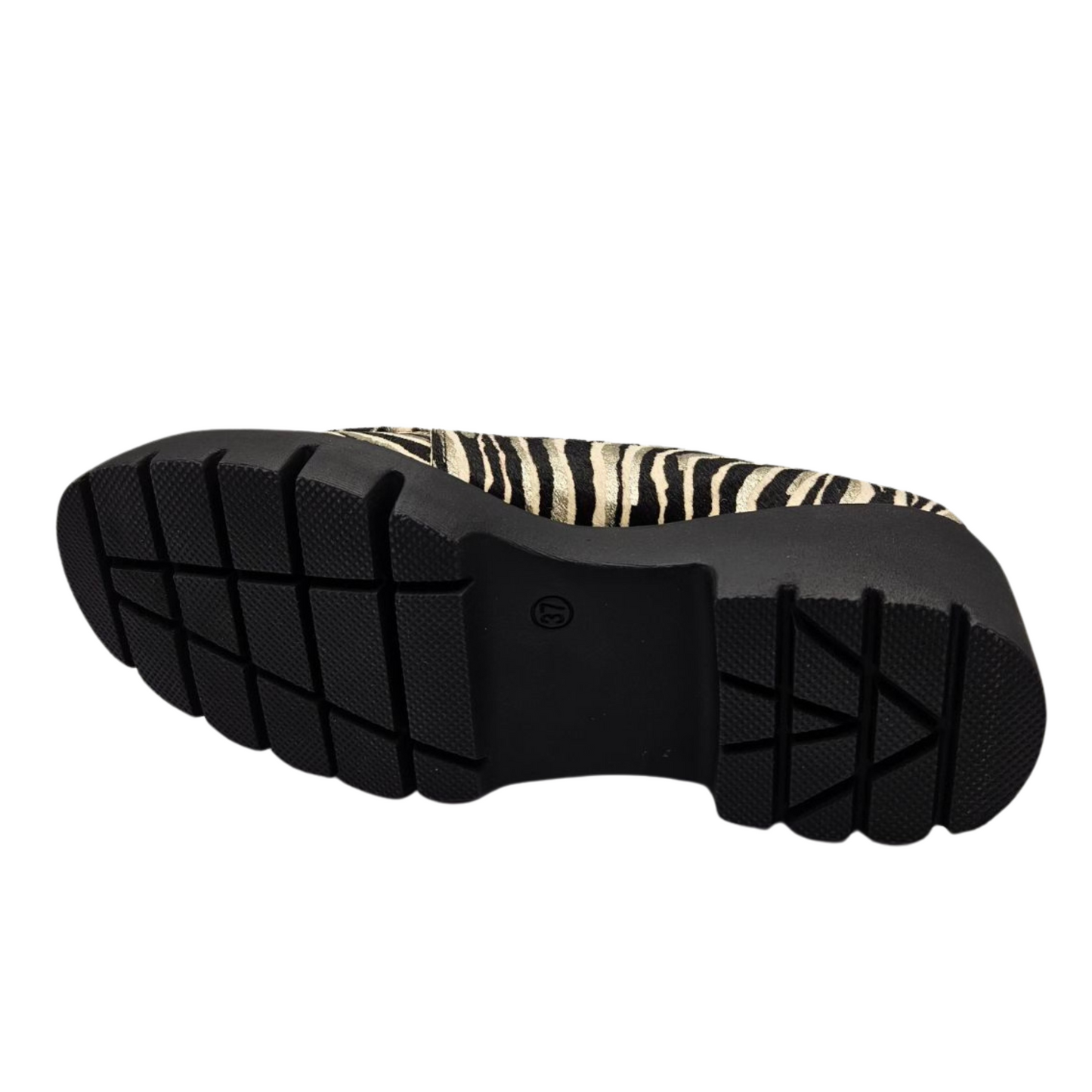 Bottom view of leather zebra print loafer. Velcro strap, pull on heel tab, rounded toe and leather lining.