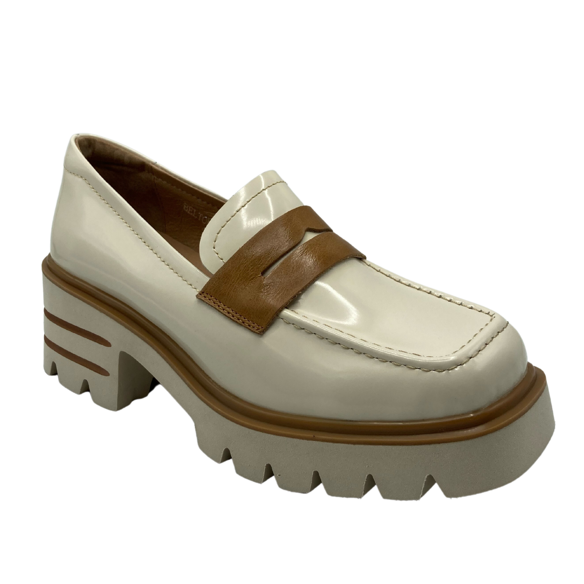 45 degree angled view of vanilla and tan coloured leather loafer with a square toe