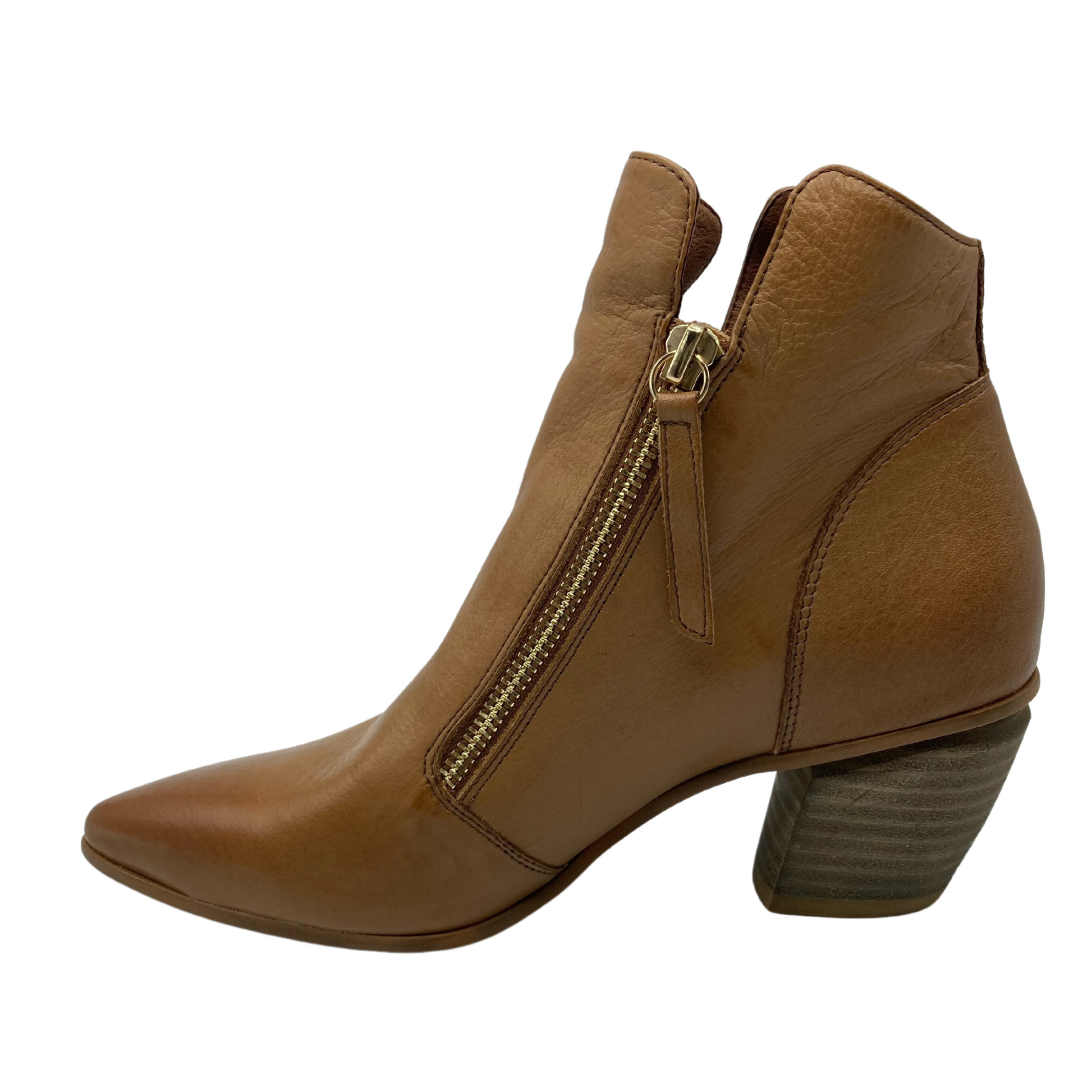 Left facing profile view of cowboy-style short leather boot with pointy toe and chunky heel