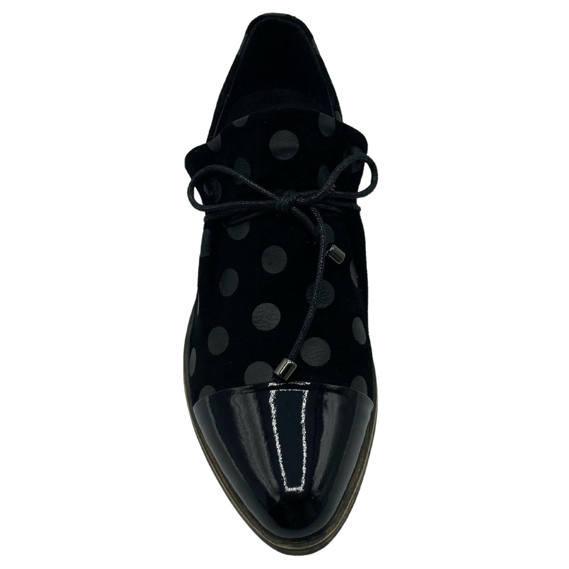 Top view of a leather shoe with patent toe cap and matching polka dot pattern on the upper