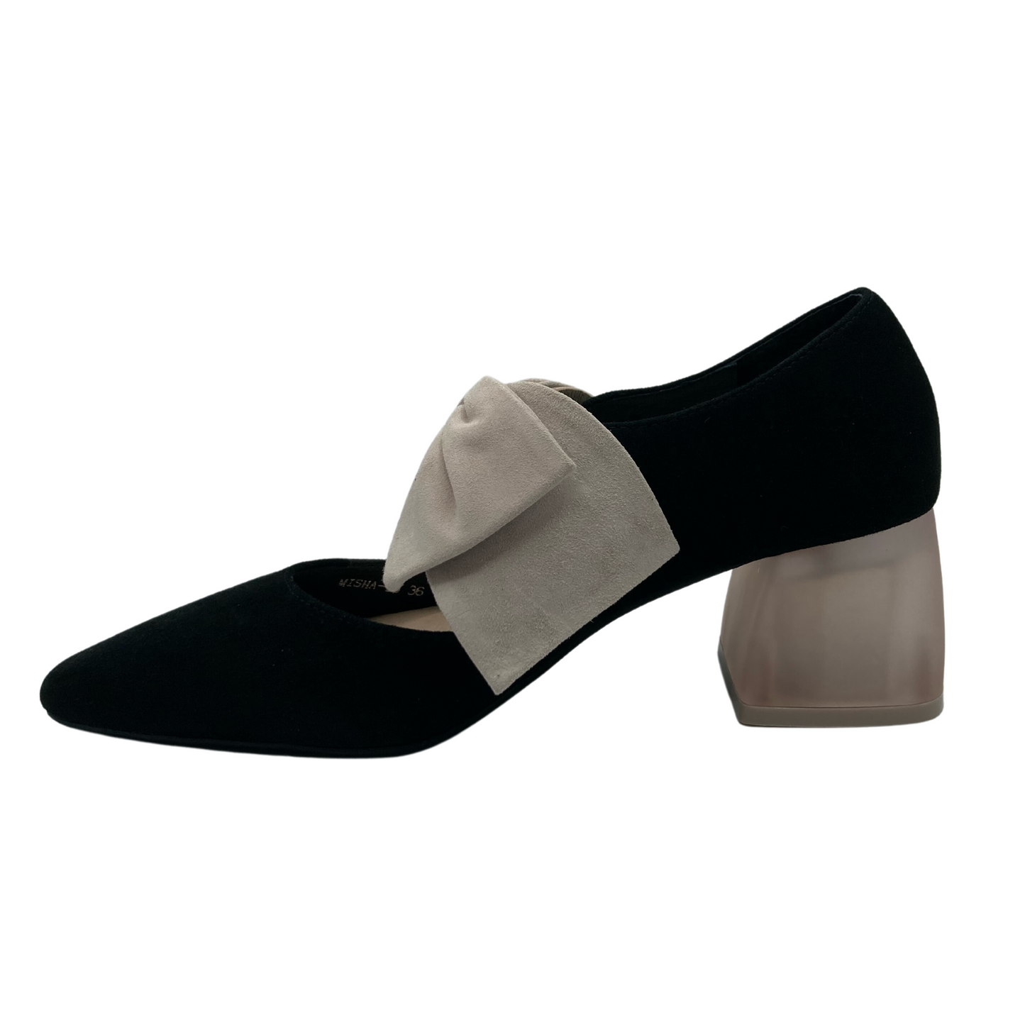 Left facing view of black heeled shoe with lucite heel and vanilla coloured bow on upper