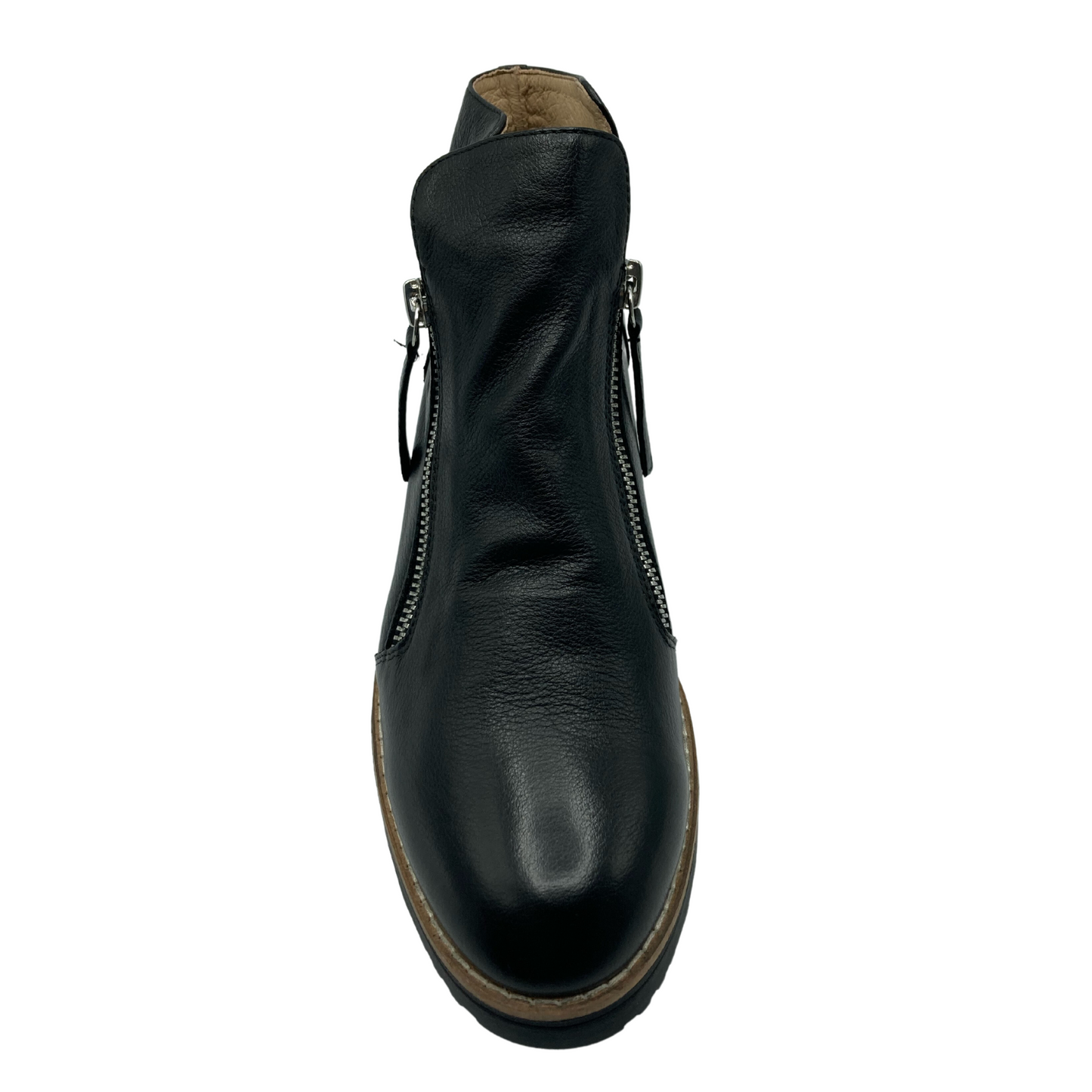 Top view of black leather boot with rounded toe and a zipper on either side of the ankle
