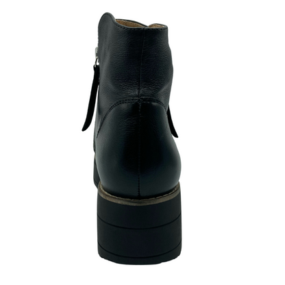 Hind view of short black leather boot with chunky heel