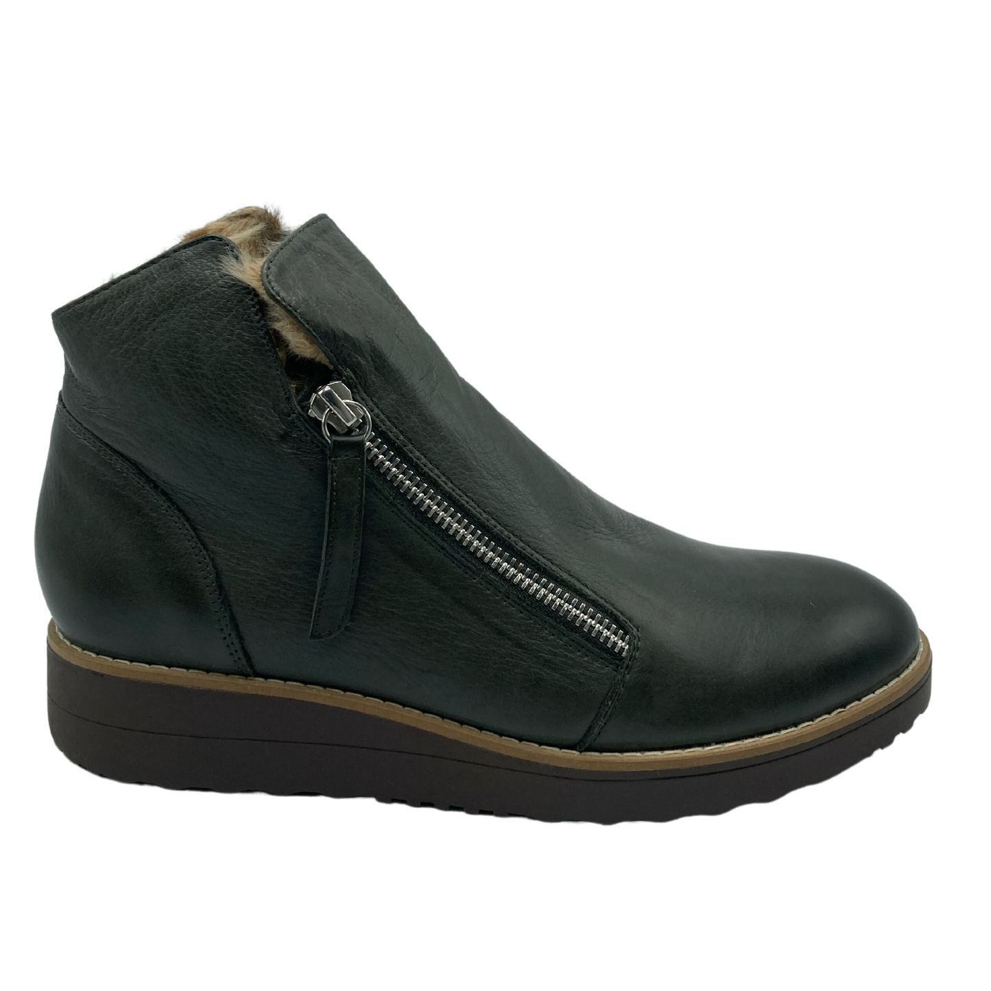 Right facing view of dark green leather ankle boot with subtle 1 inch platform and rubber sole.