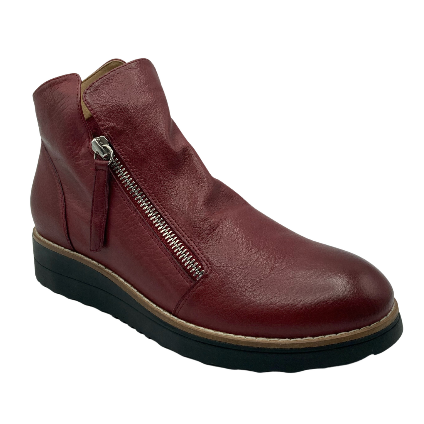45 degree angled view of short pinot red coloured leather boot with black rubber sole