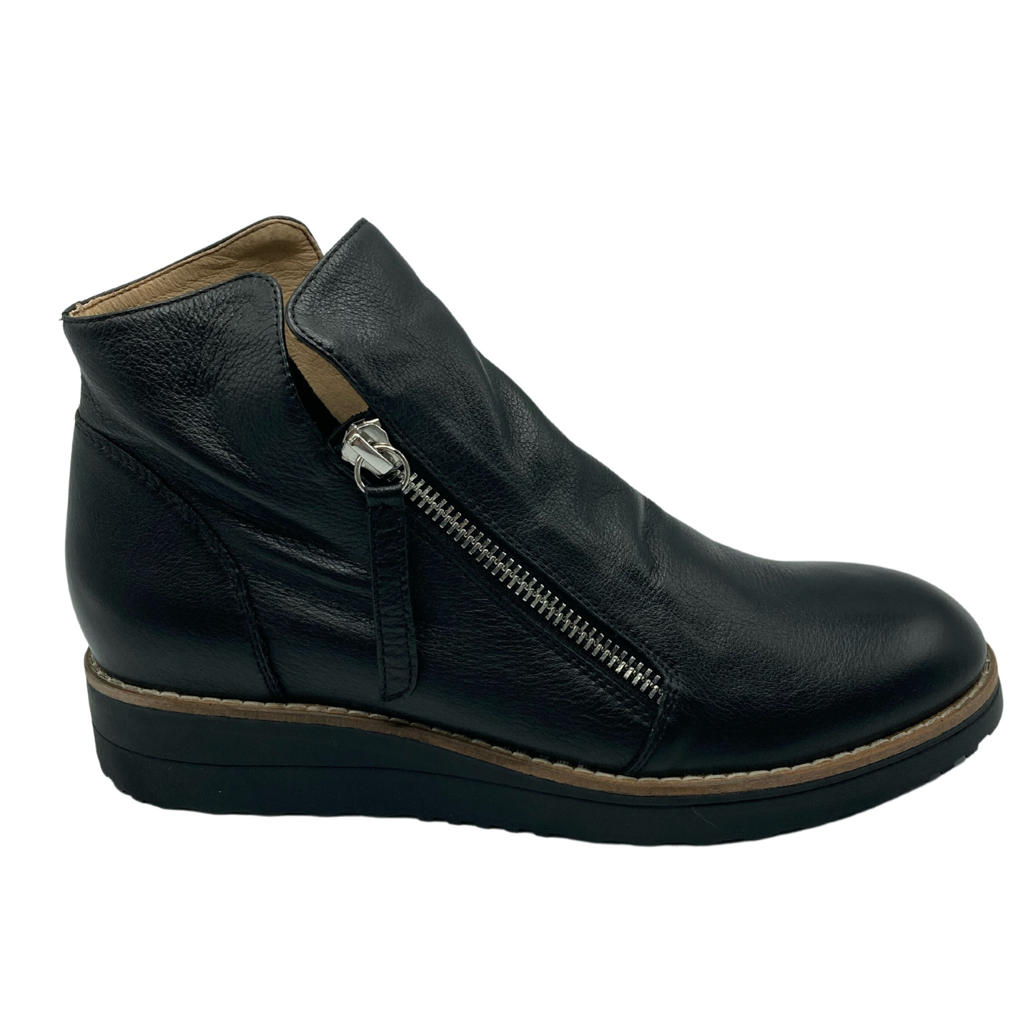 Right facing profile view of a black leather short boot with silver zipper and black rubber sole