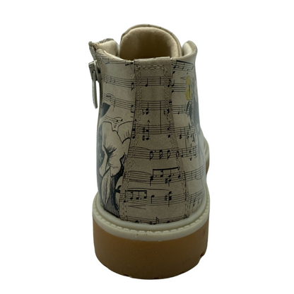 Back view of vegan leather short boot with sheet music pattern and side zipper closure
