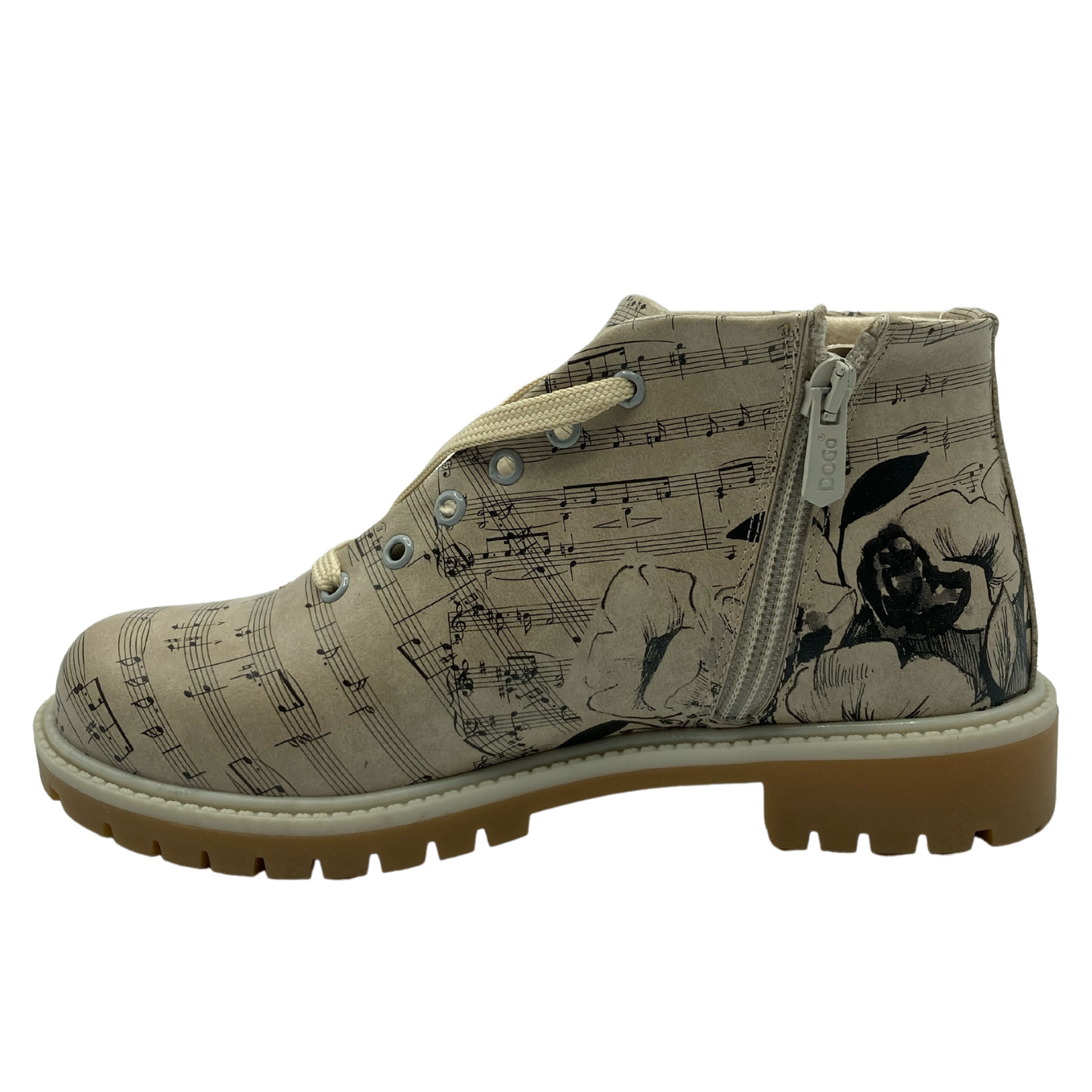 Left facing view of vegan leather short boot with sheet music pattern on upper and side zipper closure