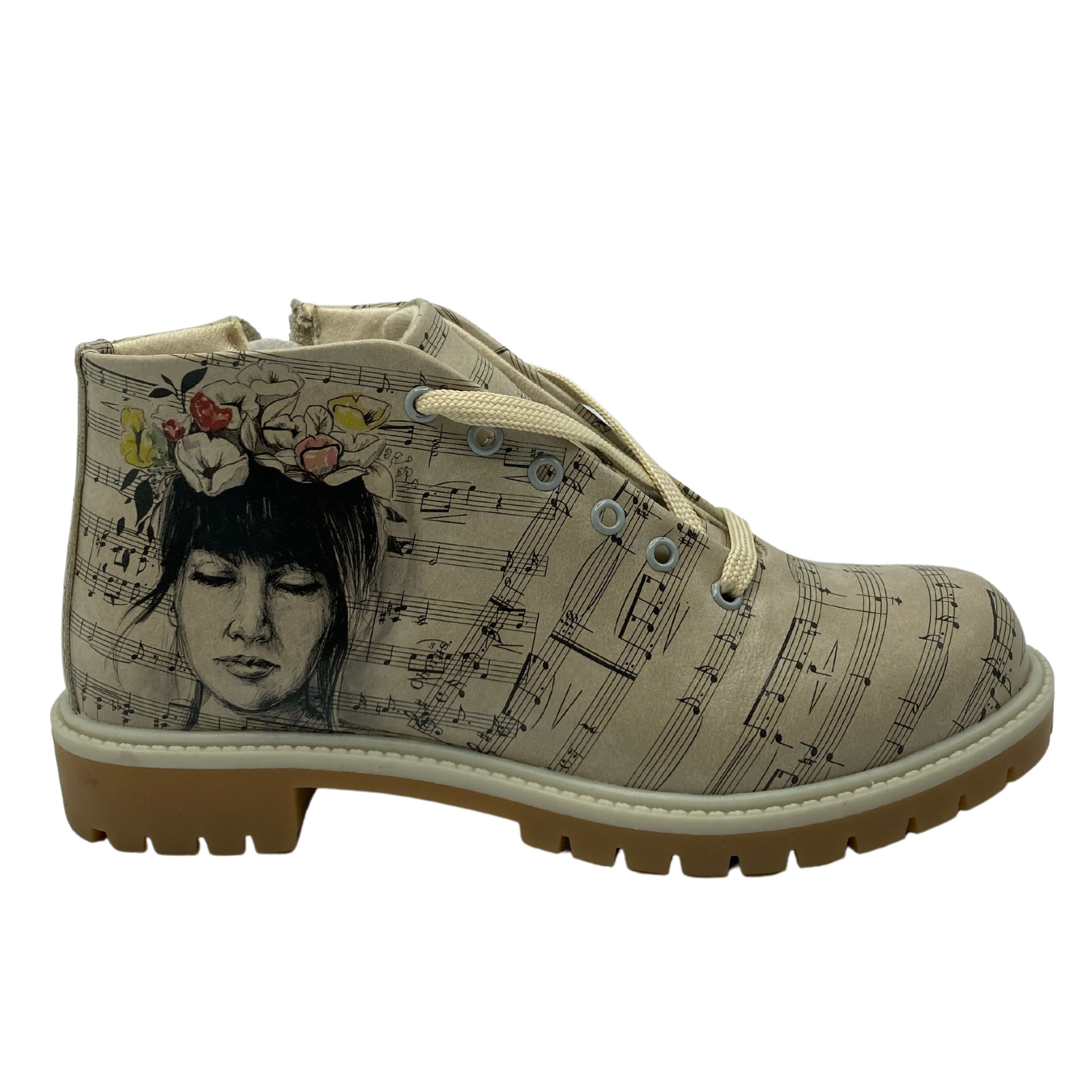 Right facing view of vegan leather short boot with sheet music pattern and an image of a woman in a flower crown on the outer ankle