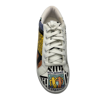 Top view of a sneaker with a white base and colourful artwork all around the upper of the shoe. Padded white collar, white laces and white rubber outsole.