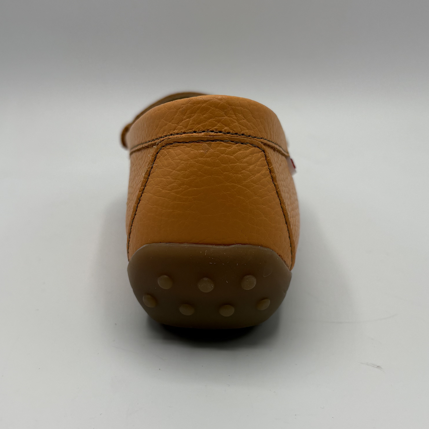 Brown leather shoe on a white background