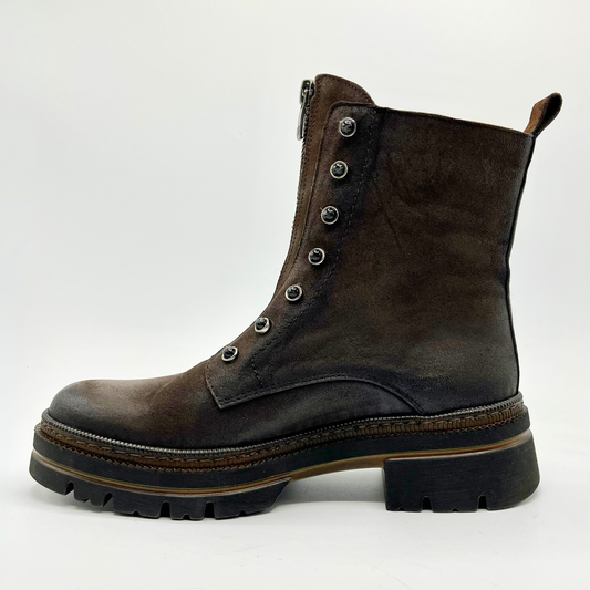 Brown leather boot with a zipper on a white background