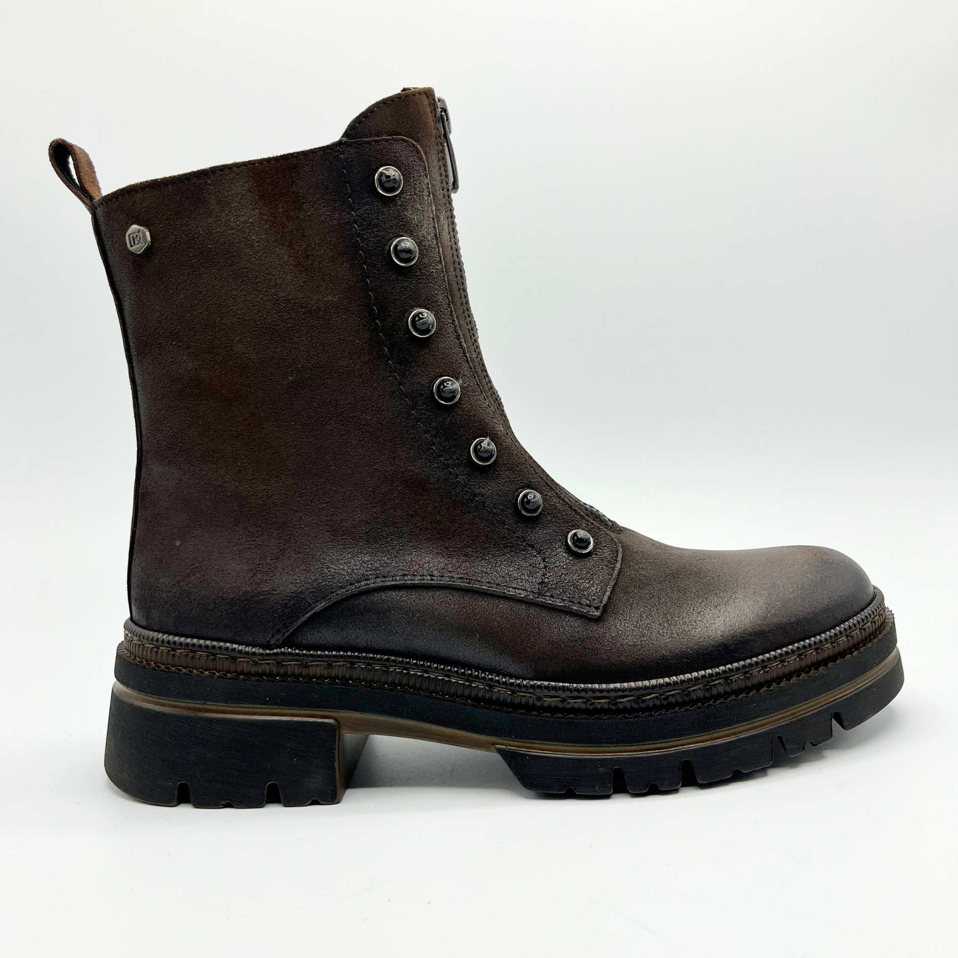 Brown leather boot with button details on a white background