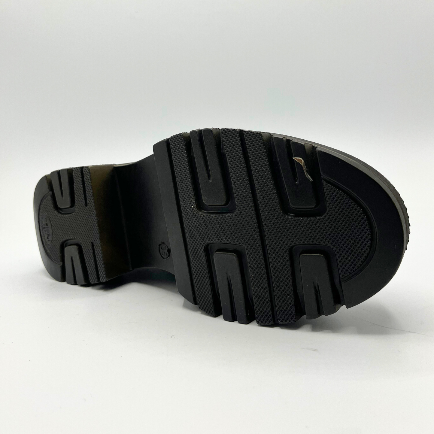 Black sole of a shoe on a white background