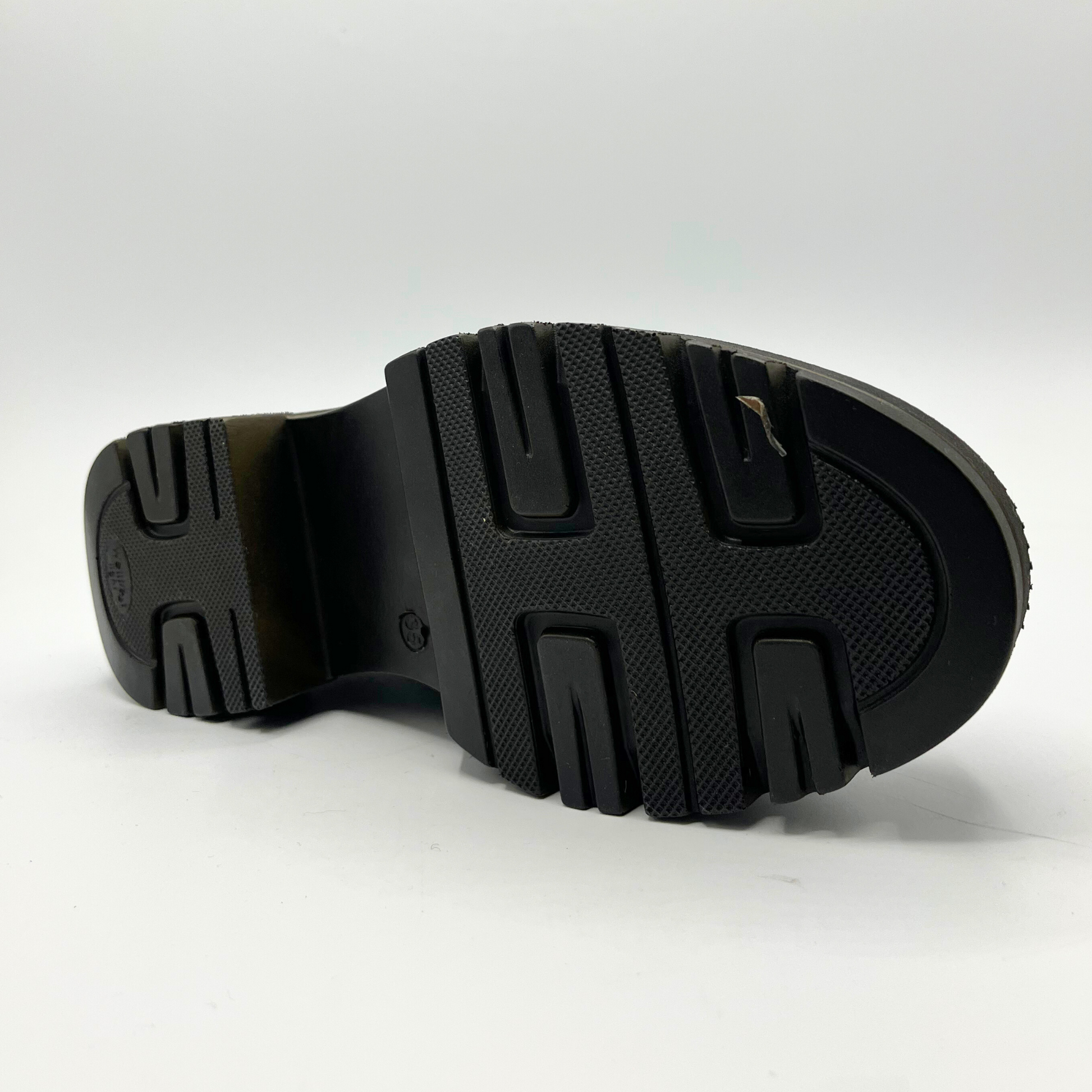 Black sole of a shoe on a white background