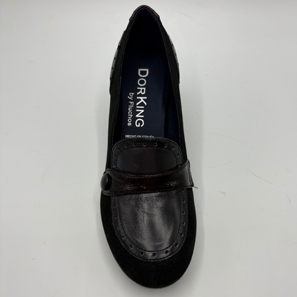 A single black Dorking by Fluchos slip-on loafer shoe with a dark brown leather strap and suede toe, photographed from a top-down angle on a light gray background.