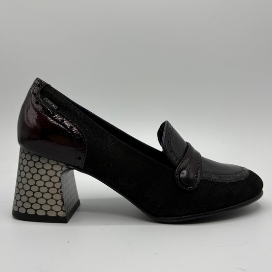 A single black loafer-style pump with a block heel, featuring a glossy patent leather toe cap, a dark patent heel, and a patterned block heel, shown against a neutral gray background.