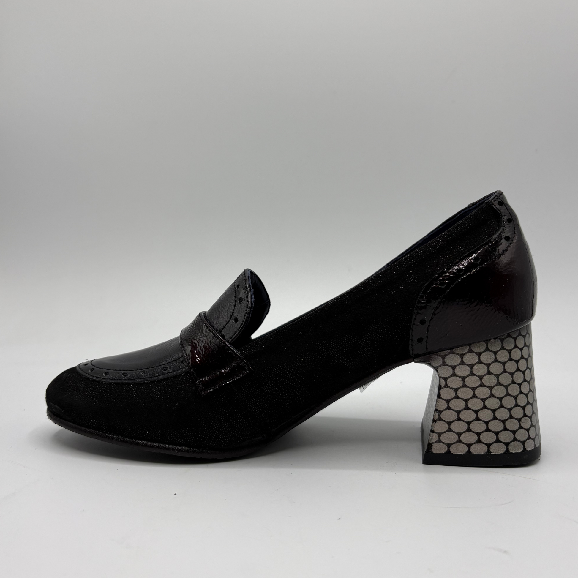 A single black suede and patent leather block-heel shoe with a honeycomb-patterned block heel, shown from a side profile on a light gray background.