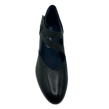 Top view of black leather pump with double velcro strap and synthetic leather lining 