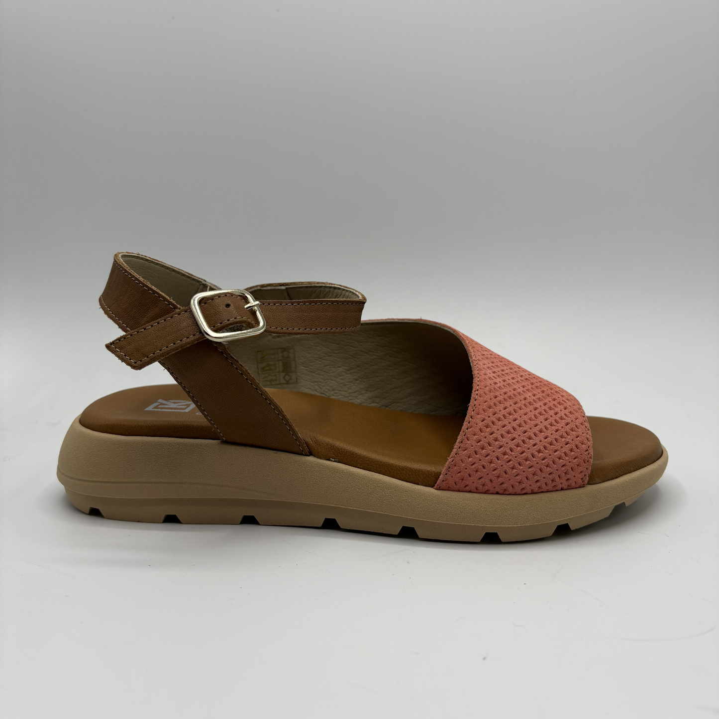Brown and pink sandal on a white background