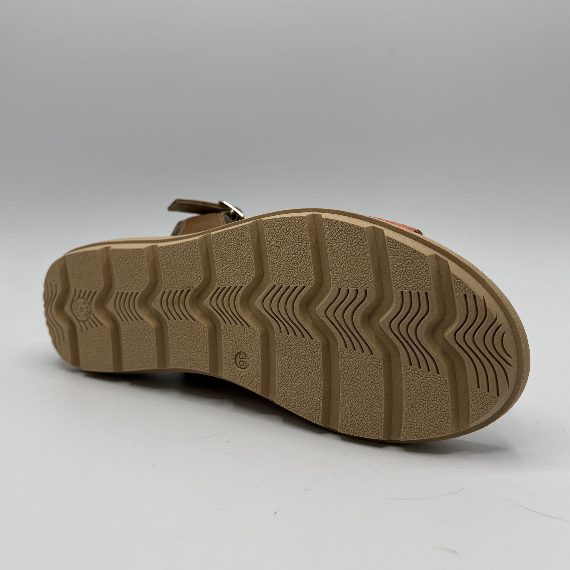 Brown sandal sole on a light gray background