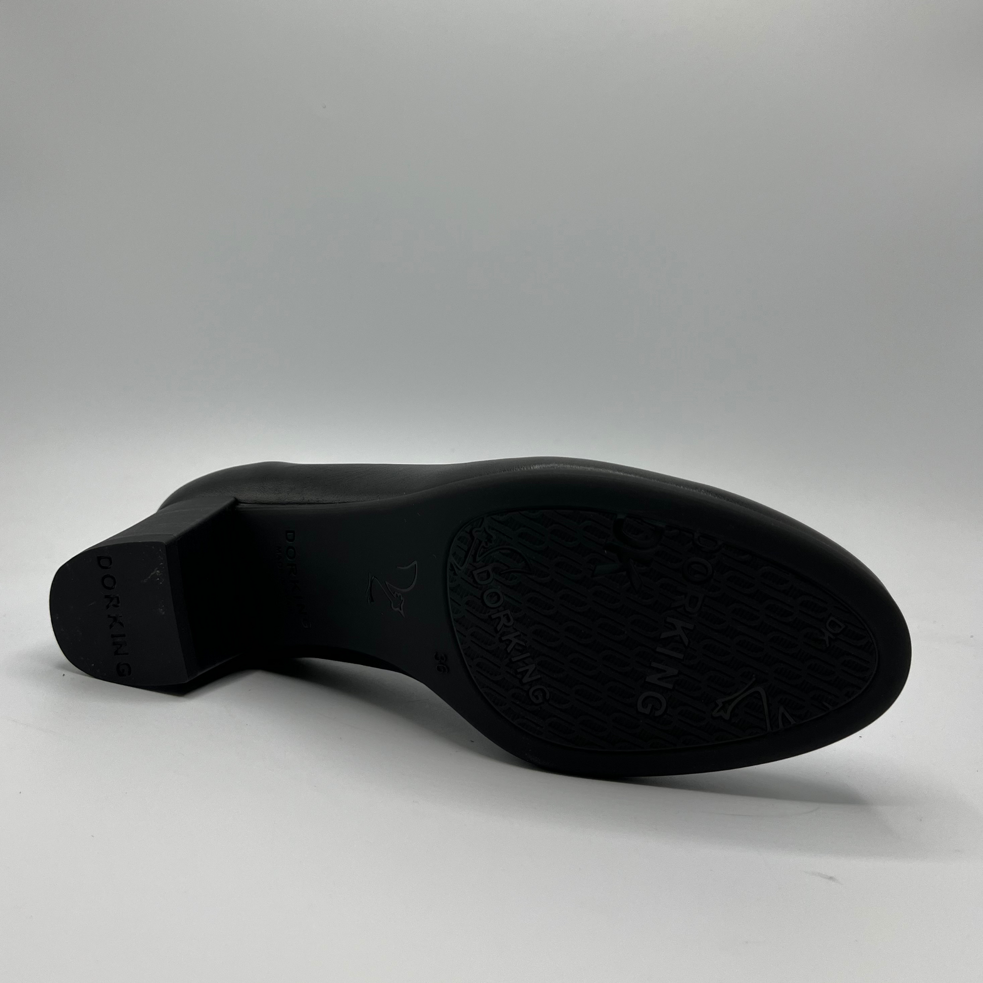 Black shoe sole on a gray background