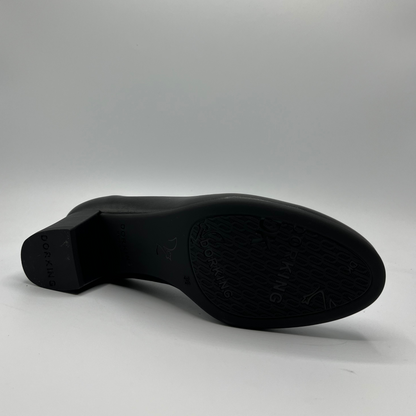 Black shoe sole on a gray background