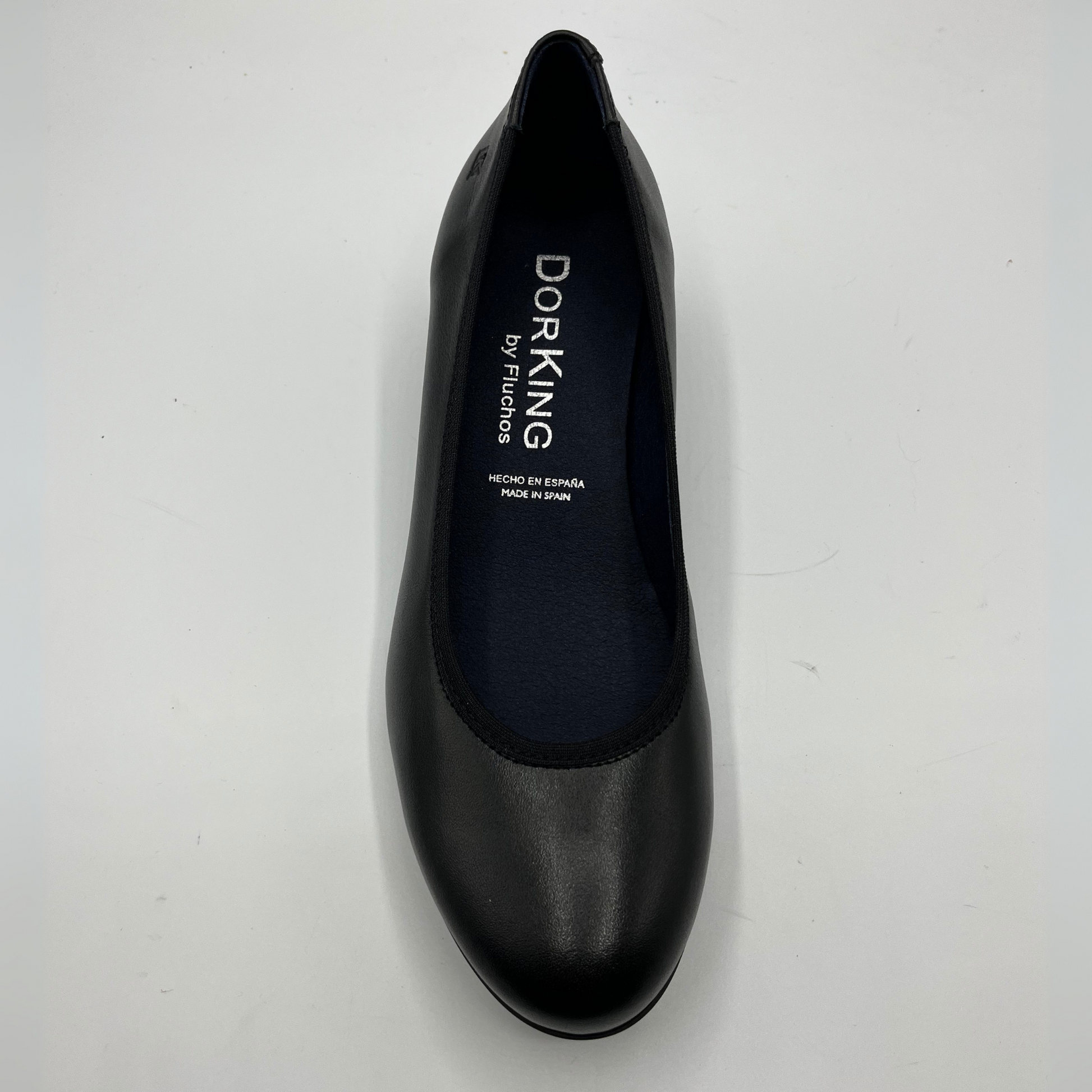 Black shoe with 'Dorking' branding on a white background