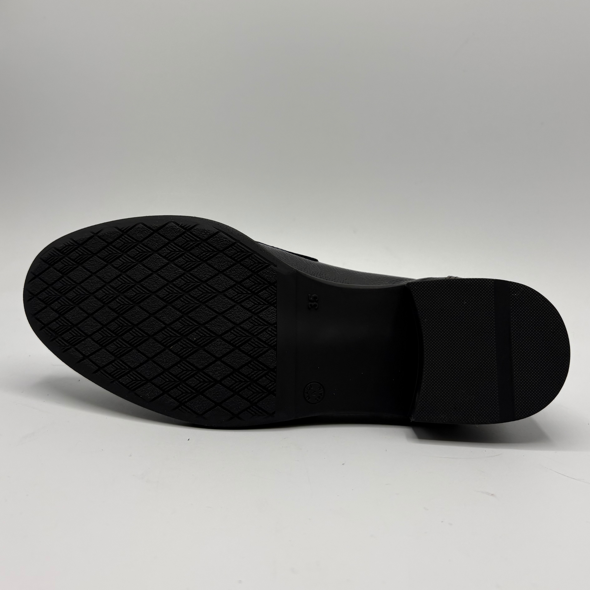 Black shoe sole on a white background