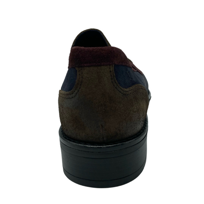 Back view of brown, red and blue suede loafer with black heel